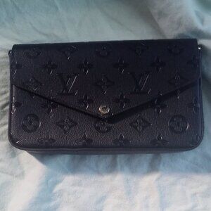 Black handbag with zipper pouch